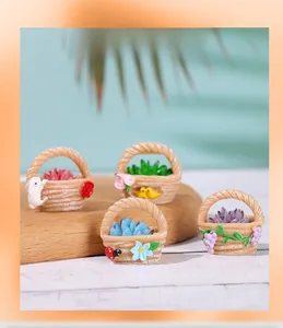 Macro shot of miniature resin flower baskets with tiny succulents and cute animal figures