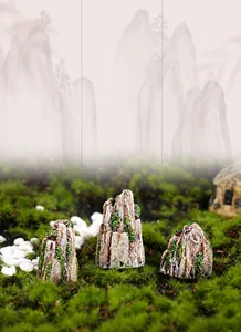 Three pieces of realistic resin rock miniatures with green moss details for micro landscapes
