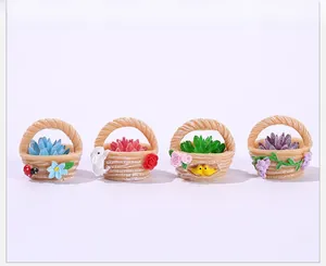 Set of four mini resin flower baskets with colorful faux succulents and animal charms