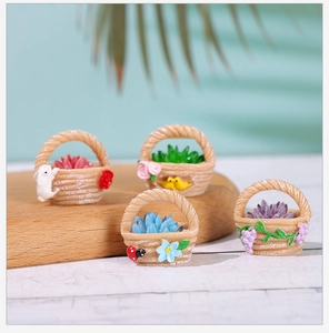 Detailed macro view of four miniature resin flower baskets with tiny succulent plants