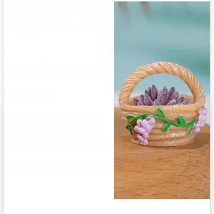 Detailed view of micro landscape resin flower basket with purple succulent and woven texture