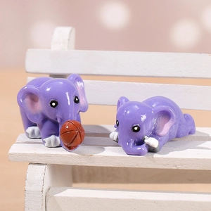 Two purple resin elephant miniatures on a white bench for garden landscape decor
