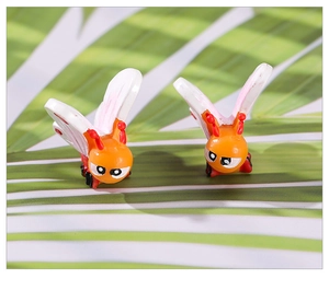 Close-up of decorative resin bees for miniature fairy gardens and succulent pots