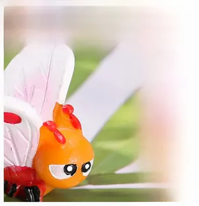 Macro detail of cartoon bee garden ornament with realistic adhesive coating process