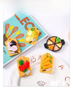 Detailed close-up of 5 resin miniature food fridge magnets with cutting board and frying pan