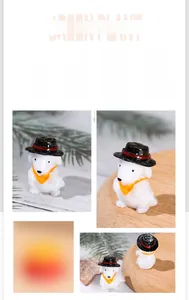 Close-up of miniature resin puppy wearing a black hat and orange scarf for DIY decor