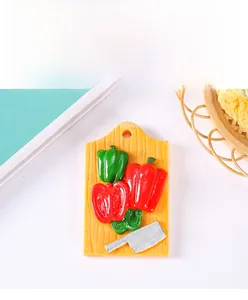 Detail view of 3D resin vegetable cutting board fridge magnet with realistic mini chili