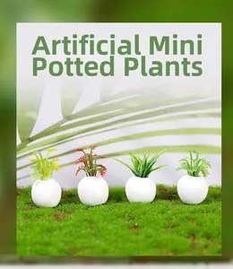 Close-up of four artificial mini succulent plants in white round pots for dollhouse decor
