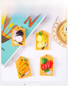 Macro shot of 4 resin food magnets showing vegetable cutting board miniatures