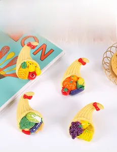 Detailed view of miniature resin fruit baskets with pineapple and pumpkin for DIY decor