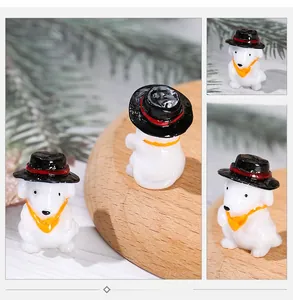 Close-up of resin miniature puppy with black top hat and orange scarf for DIY bonsai
