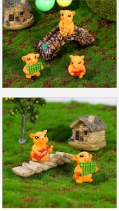 Detailed hamster band resin figurines playing instruments in a lush fairy garden layout