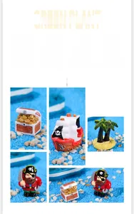 Detailed close-up of pirate micro-landscape figurines with resin treasure chest and ship