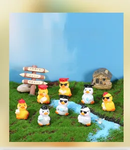 Miniature graduation ducks with mortarboards and sunglasses in a creative landscape