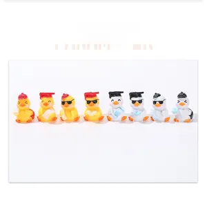 Close-up of eight cute cartoon graduation ducks with mini mortarboards and sunglasses