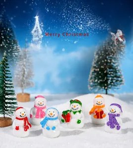 Set of six miniature resin Christmas snowmen with colorful hats and scarves in snow scene