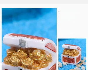 Detailed view of mini resin treasure chest with gold coins for aquarium landscaping