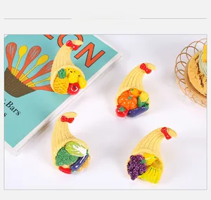 Detailed close-up of resin fruit basket magnets with colorful miniature vegetables