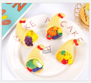 Macro detail of miniature resin cornucopia baskets with realistic colorful fruits and vegetables
