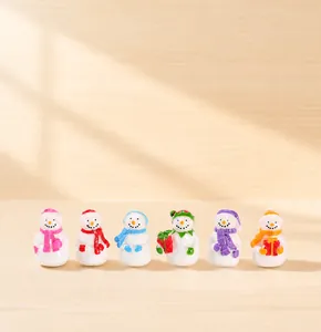 Detailed view of six miniature resin Christmas snowmen with colorful hats and scarves