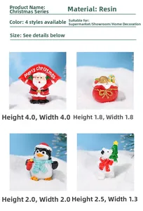 Detailansicht von vier Weihnachtsminiaturen aus Harz mit Weihnachtsmann und Pinguin