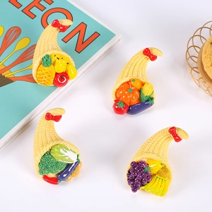 Miniature resin harvest cornucopia with fake fruits and red bow for DIY crafts