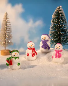 Miniature resin snowmen in red green purple and pink for Christmas micro landscape