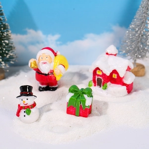 Miniature Christmas landscape set with Santa Claus, snowman, snow house, and gift box