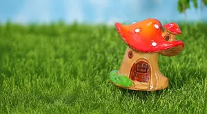 Macro detail of hand-painted resin mushroom house ornament for moss micro landscape decor
