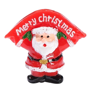 Miniature resin Santa Claus figurine holding a red Merry Christmas banner on white background