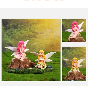 Detail of miniature flower fairy figurines with translucent wings on mossy wood bases
