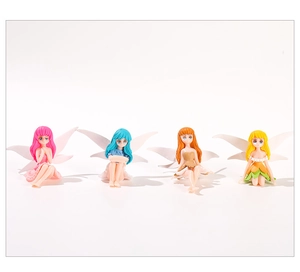 Detailed view of four colorful flower fairy figurines with translucent wings for decor