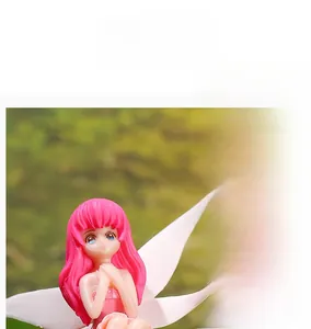 Macro close-up showing the realistic texture and pink dress of a miniature flower fairy