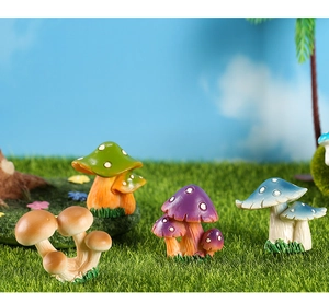 Detailed view of four colorful resin mushroom figurines on a miniature lawn landscape