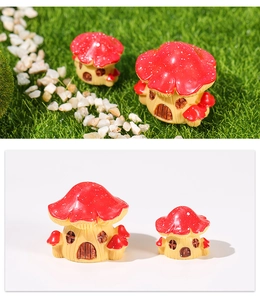 Macro detail of red mushroom house resin miniatures for DIY terrarium landscaping