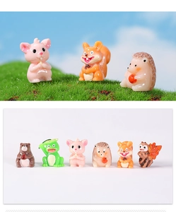 Close-up of cute resin animal miniatures featuring mouse, hedgehog and frog figurines