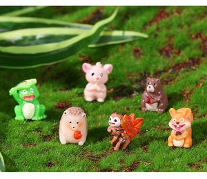 Miniature resin animal figurines set including frog, pig, and bear on green moss