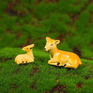 Resin deer figurines set for miniature landscape gardening decor on green moss background