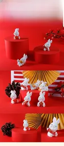 Miniature resin rabbit figurines for micro landscapes with festive red and gold ornaments