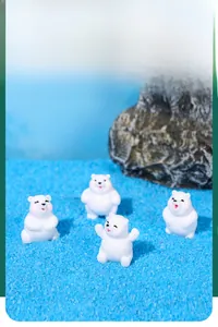 Detail of four miniature resin polar bear figurines for micro landscape decoration