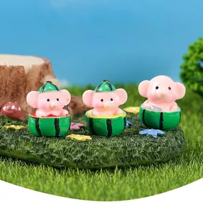 Detailed trio of miniature resin elephants wearing watermelon hats for garden micro landscapes
