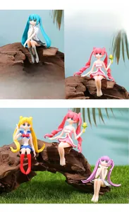 Detail shot of cute anime girl PVC miniatures sitting on logs for DIY micro landscapes