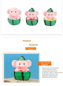 Detail view of pink elephant resin miniature with watermelon hat in high-quality finish