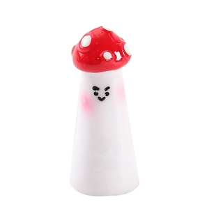 Miniature red resin mushroom with white dots and a smiling face for garden decor