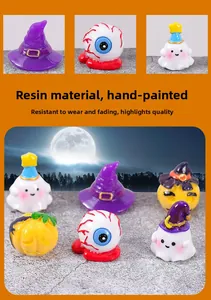 Close-up of resin Halloween miniatures featuring spooky eyeballs and mini ghosts