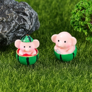 Miniature resin pig figurines in watermelon shells for garden micro landscapes