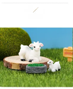 Close-up of miniature resin sheep family figurines for succulent garden and micro landscapes
