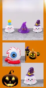 Miniature resin Halloween decorations featuring ghosts and spooky bloodshot eyeballs