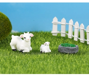 Miniature resin sheep figurines and grey feed trough for succulent garden decor