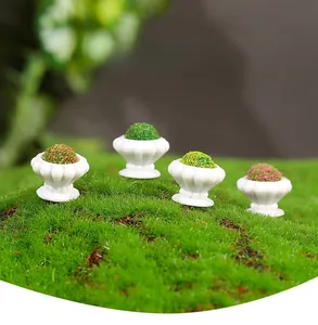 Detailed macro of four miniature dollhouse potted plants with colorful textured foliage
